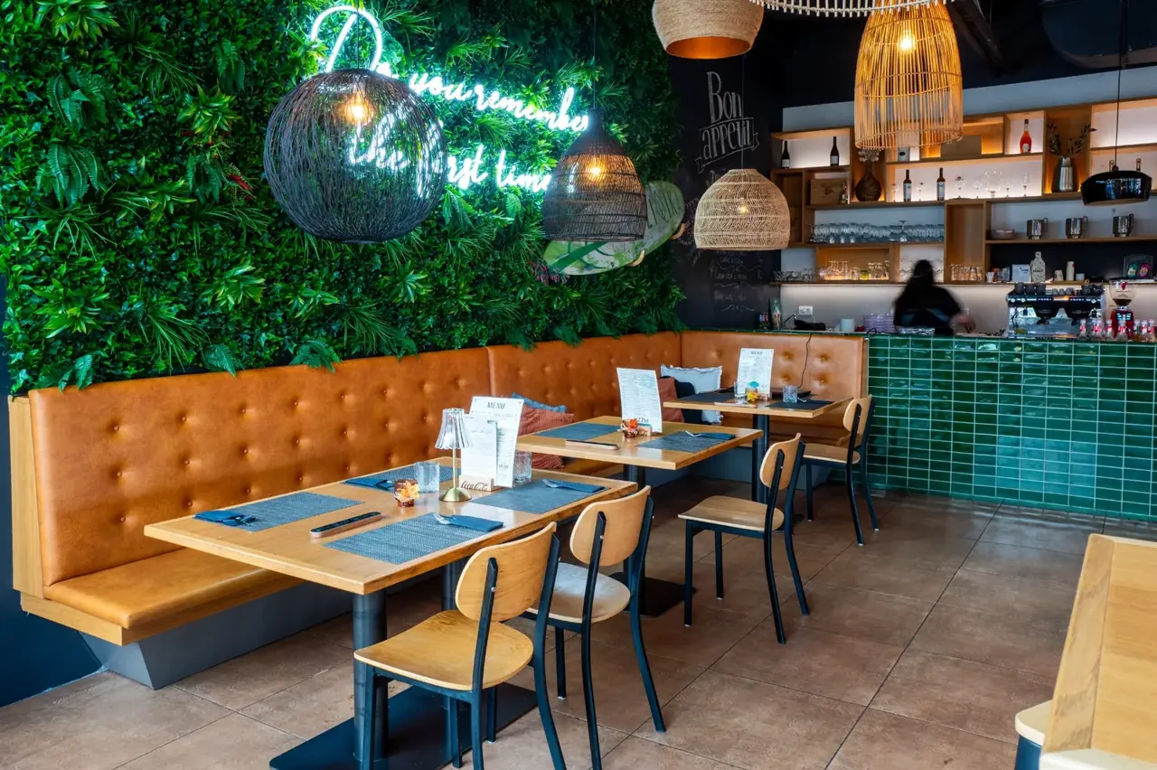 Tables by the green wall